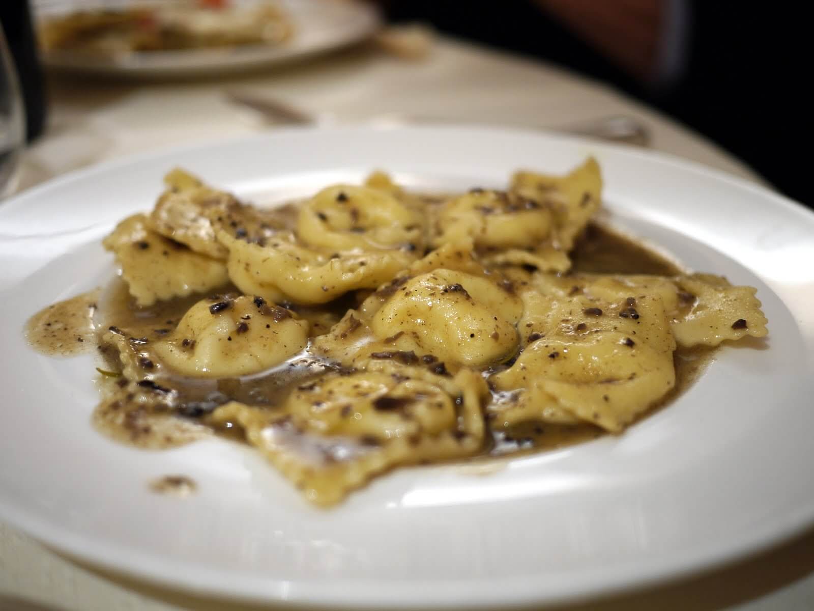 Homemade tortellini with white truffle and extra virgin olive oil — authentic Italian gourmet recipe, premium European pasta dish by Vitalitaly