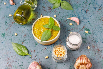 Pesto alla Genovese ingredients with fresh DOP basil, pine nuts and Parmesan - Authentic Ligurian recipe preparation by vitalitaly
