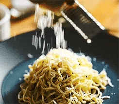 Vitalitaly Spaghetti with freshly grated Parmesan falling in elegant motion — Artisan bronze-drawn Italian pasta celebrating the poetry of authentic Italian cuisine